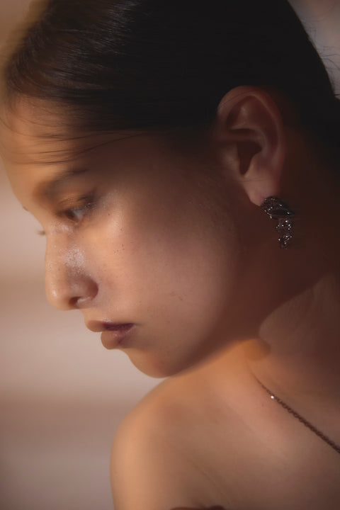 Pluto Rebirth pierced earrings Black