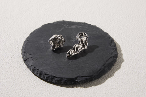 Pluto Rebirth pierced earrings Silver