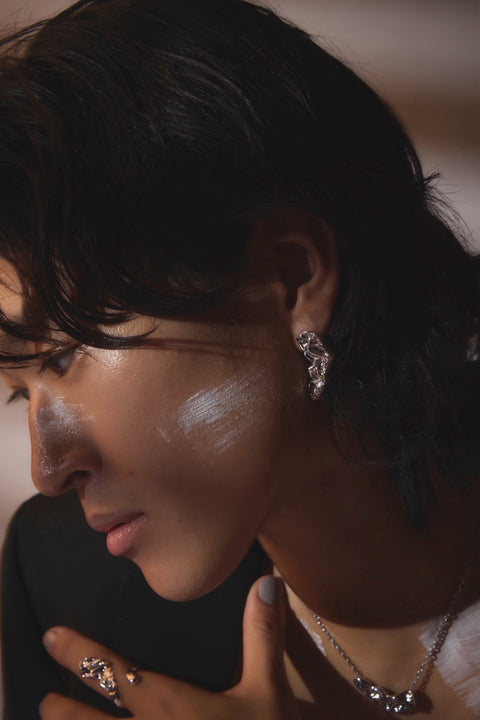 Pluto Rebirth pierced earrings Black