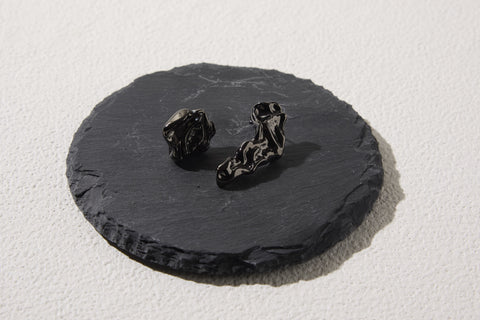 Pluto Rebirth pierced earrings Black